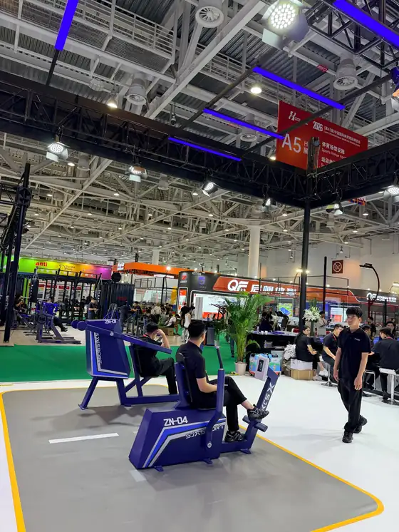 Trade fair hall, sports equipment stands and visitors